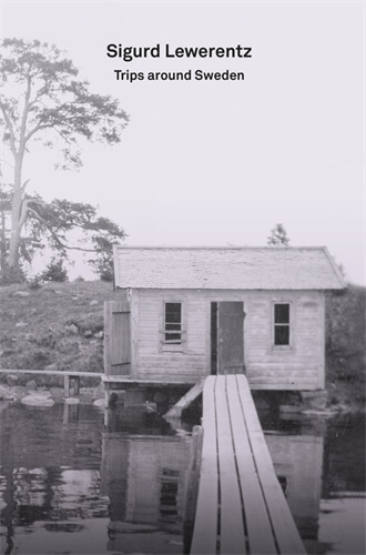 black and white cover photograph of bridge over small lake, leading to small cottage. Title placed top, center in medium weight, sans serif font