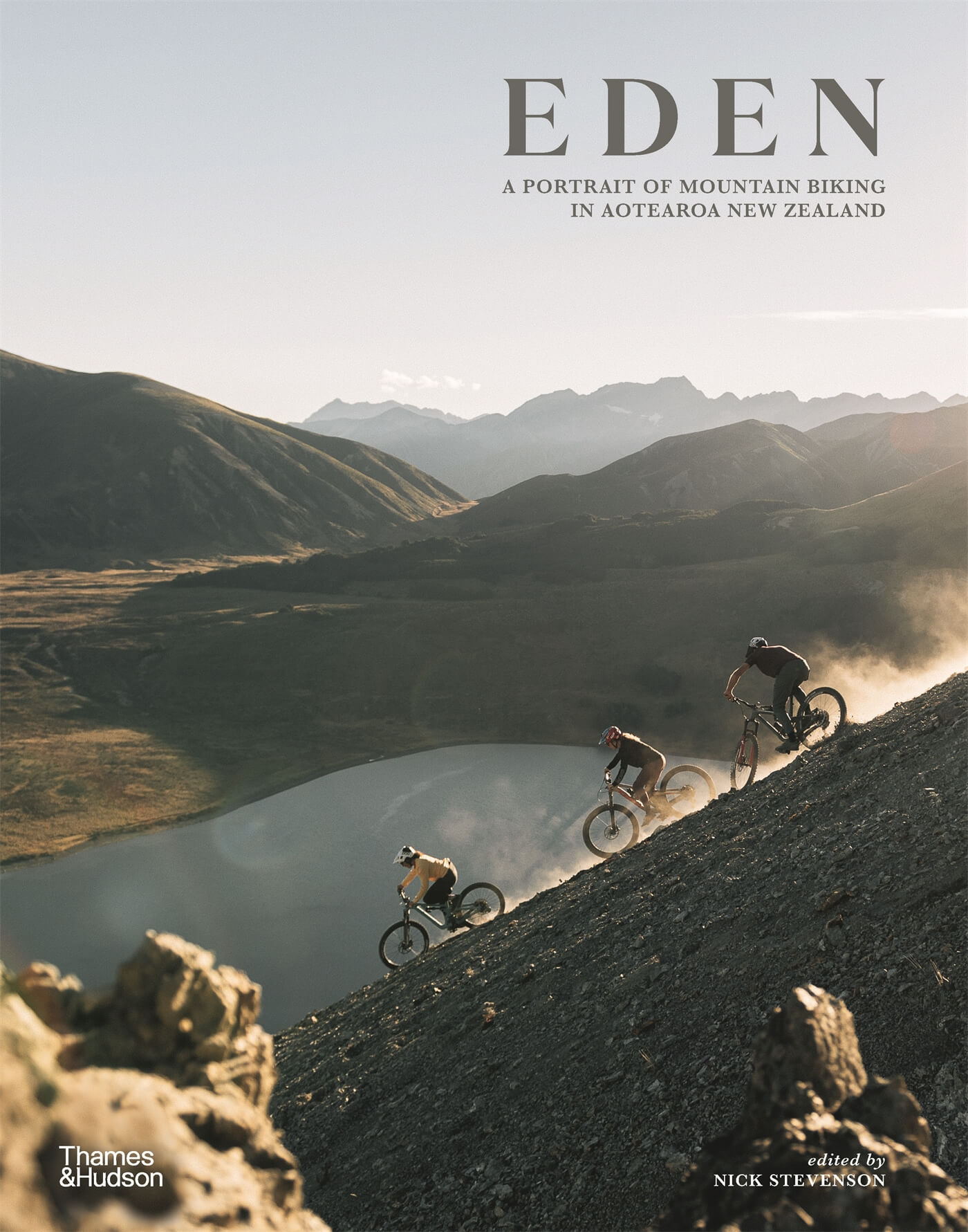 book cover featuring NZ wilderness and mountain bike